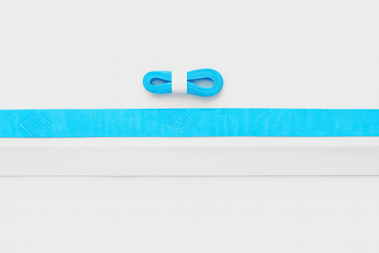 Blue and white grip tape strips with an embossed diamond pattern on white background.