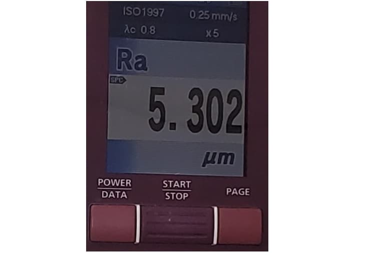 Surface roughness tester screen displaying an Ra measurement value of 5.302 micrometers.